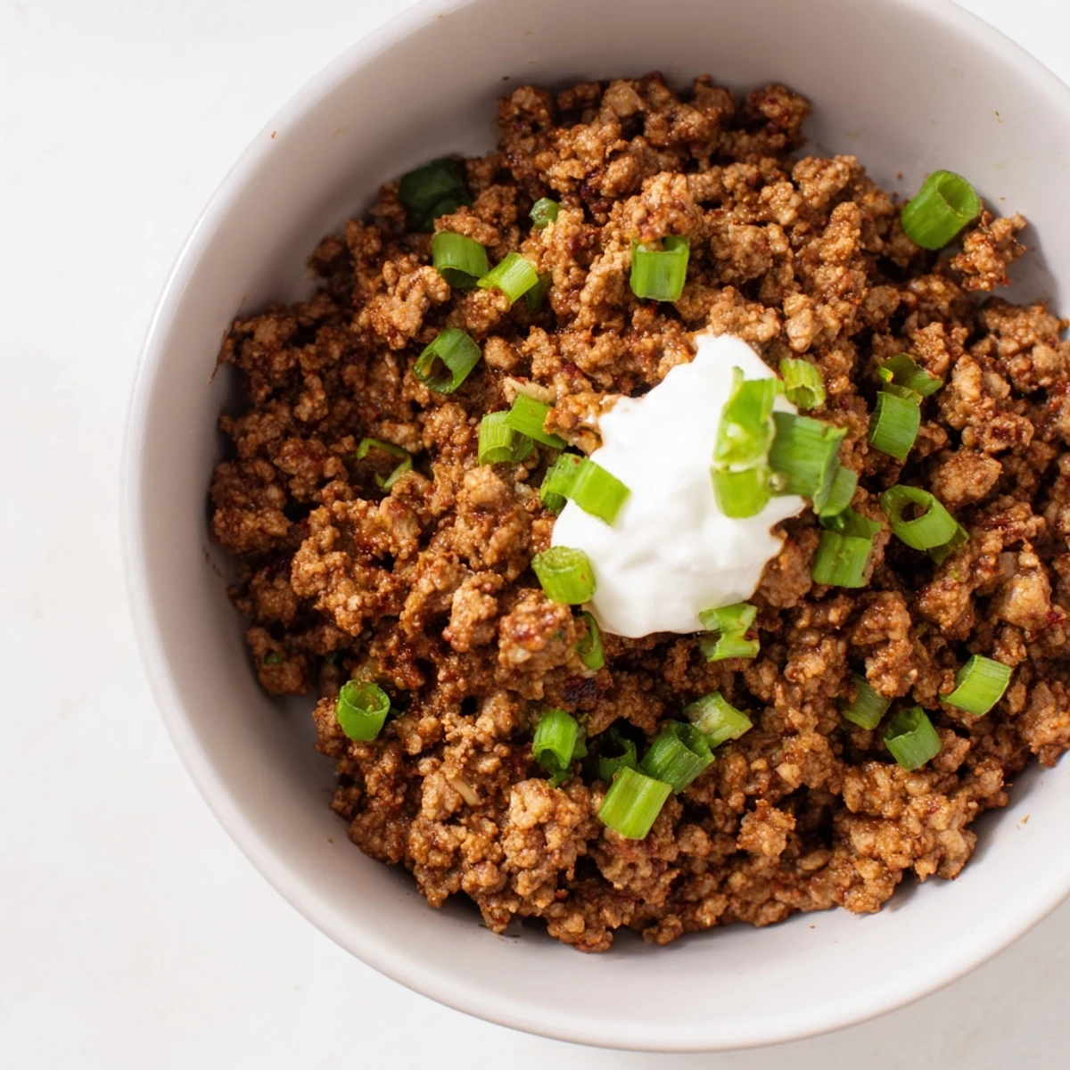 Seasoned ground beef and fluffy cilantro lime rice make these Beef Burrito Bowls a hearty, colorful dinner option.