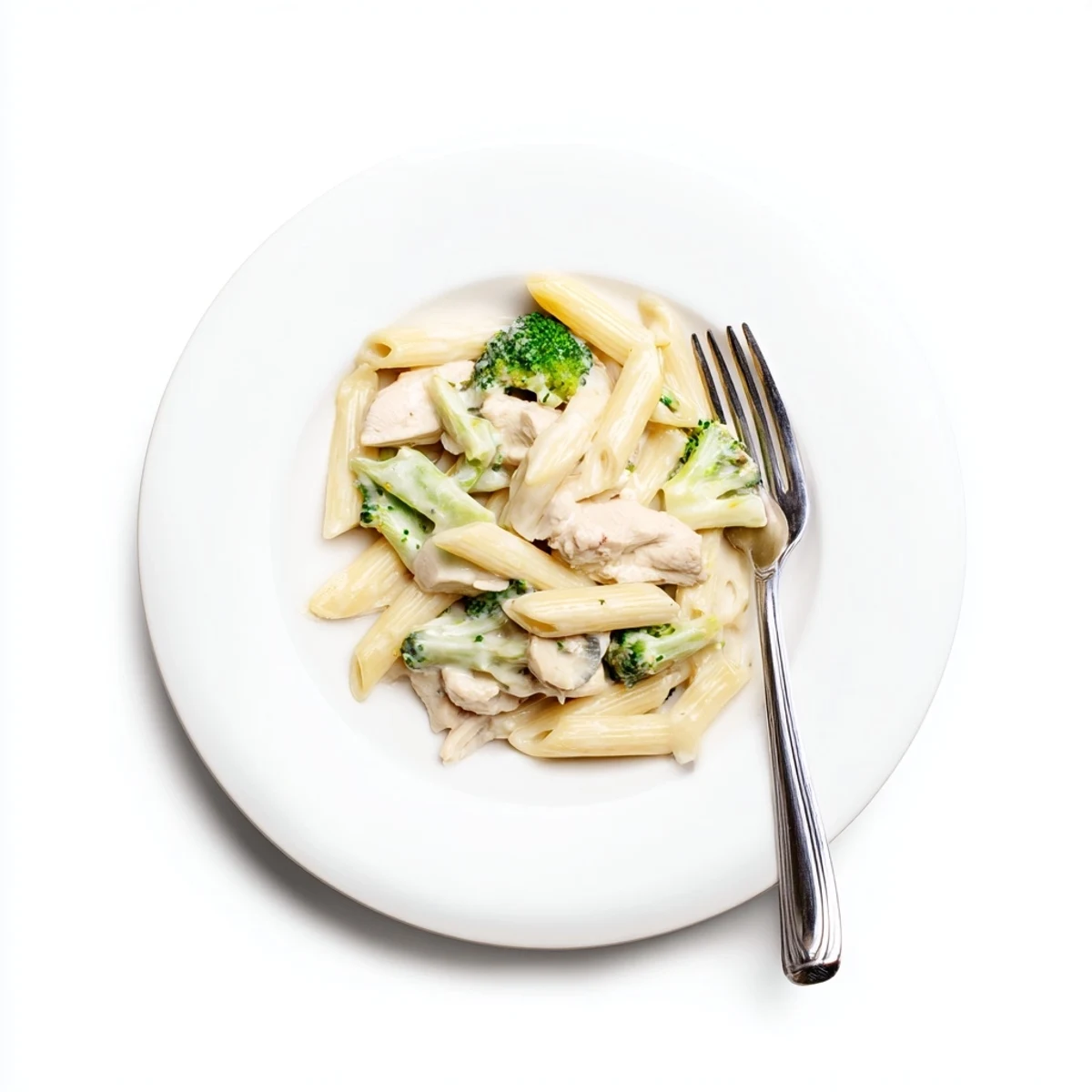 Delicious family-style dinner of Creamy Broccoli Pasta with Chicken, tossed with al dente pasta, sautéed chicken, and vibrant broccoli on a rustic wooden table.
