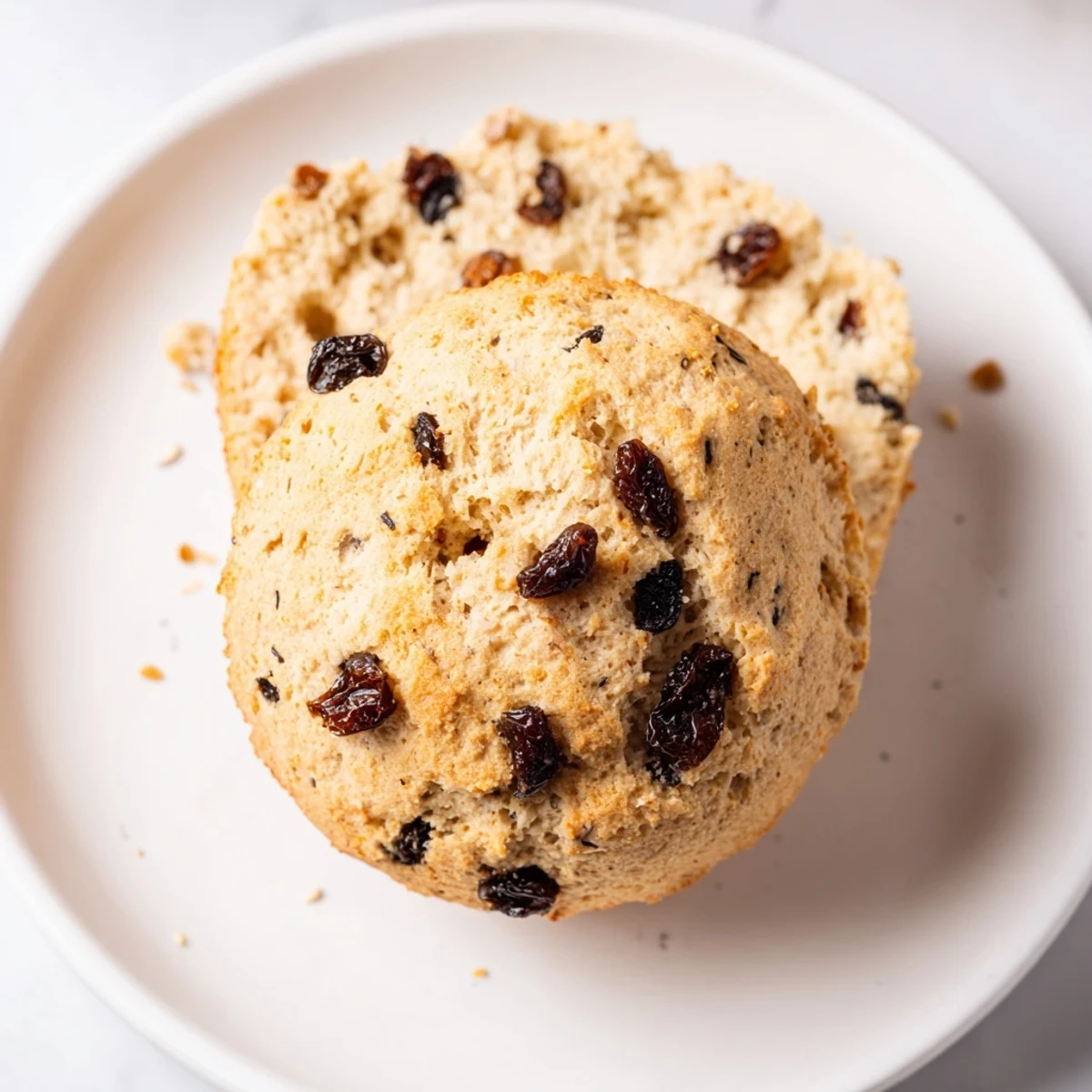 Freshly baked Irish Soda Bread Muffins with raisins, warm from the oven on a cooling rack.  