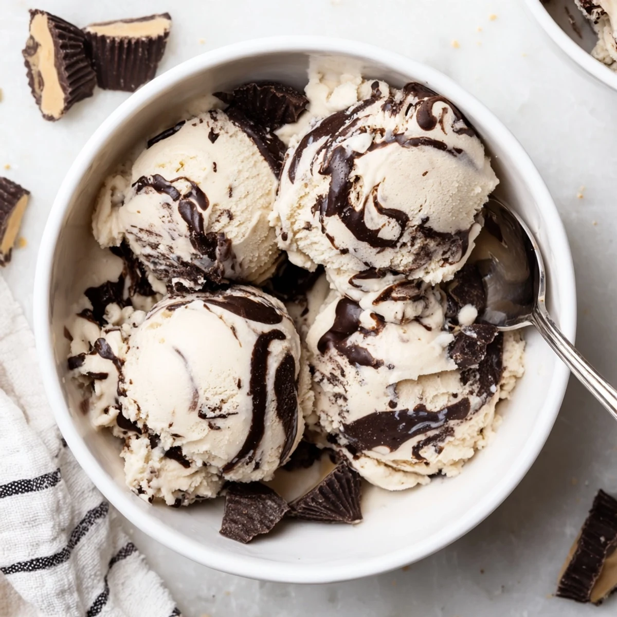 Creamy Homemade Moose Tracks Ice Cream swirled with rich fudge ribbons and chocolate peanut butter cups