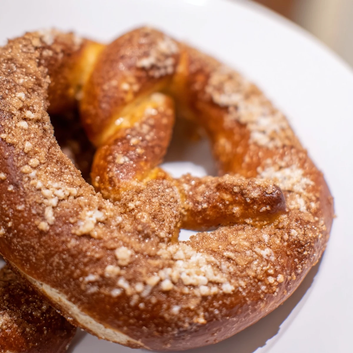 Golden brown cinnamon sugar soft pretzels brushed with butter and sprinkled with sweet spice coating