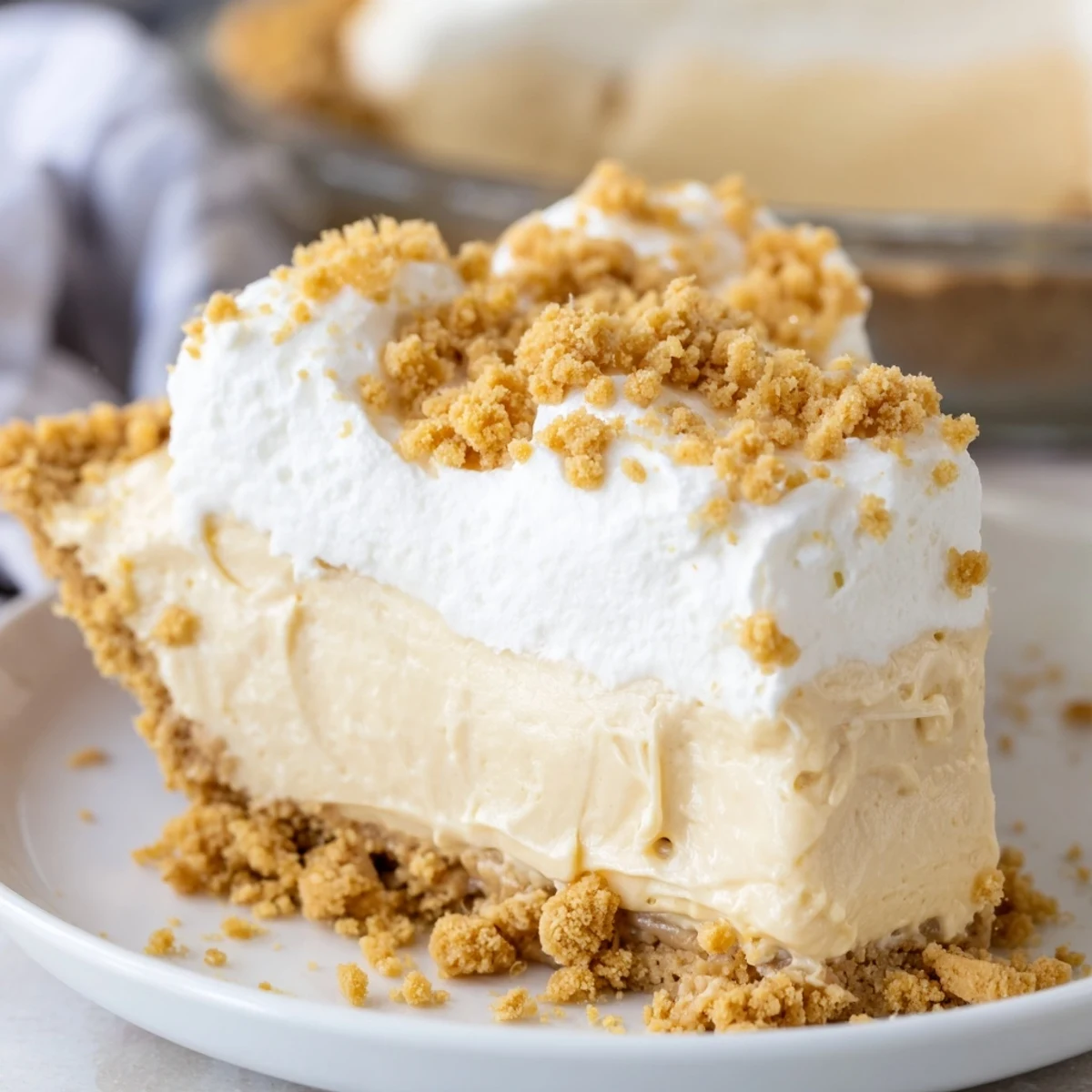 Velvety Amish Peanut Butter Dream Pie slice showing rich custard filling and crumb topping