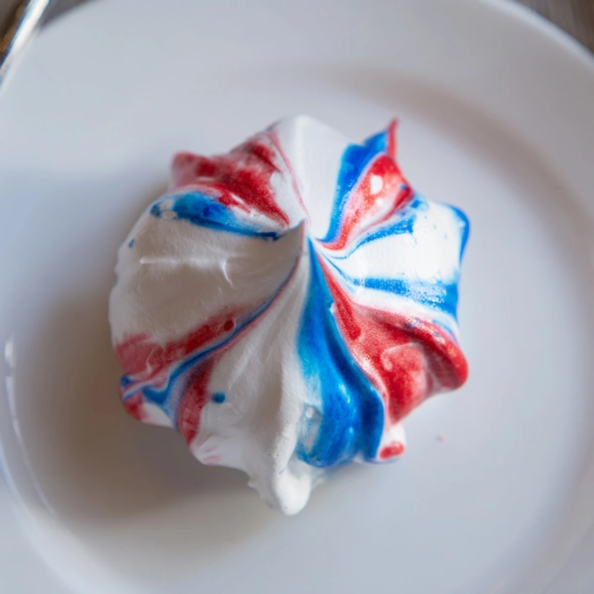 Fresh Patriotic Meringue Kisses piped with glossy peaks, perfect picnic treats.