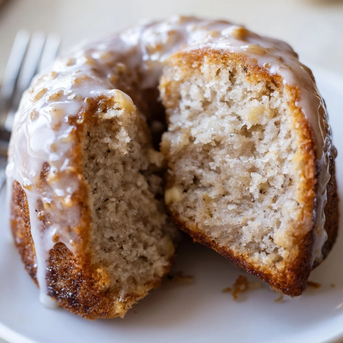 Warm Banana Donuts glazed with vanilla, served on a plate with coffee
