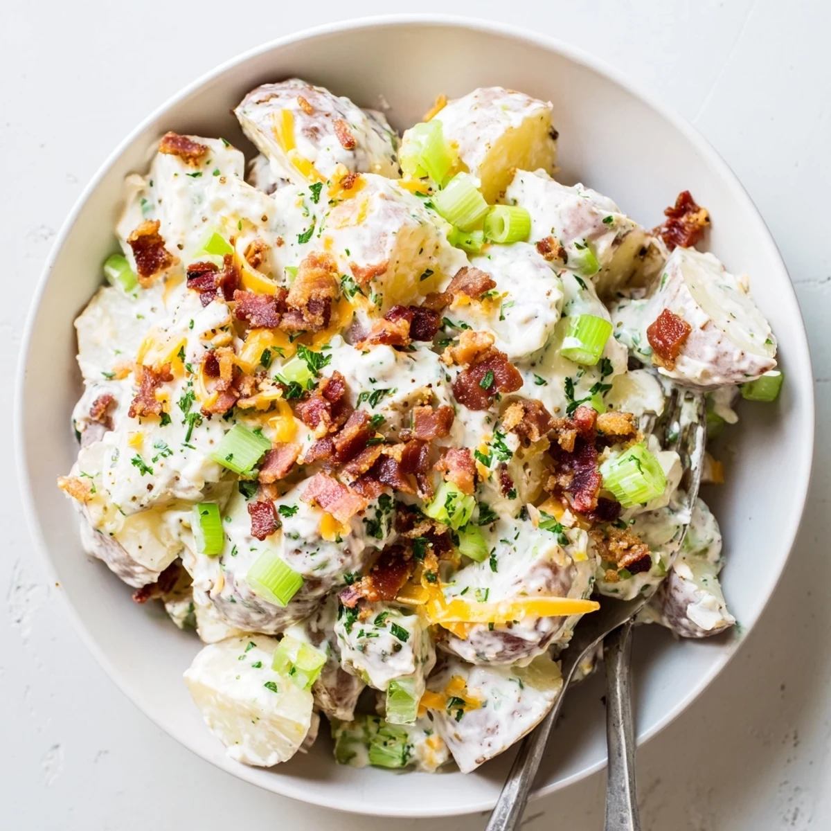 Chilled Beef Bacon Loaded Potato Salad with sharp cheddar, green onions, parsley