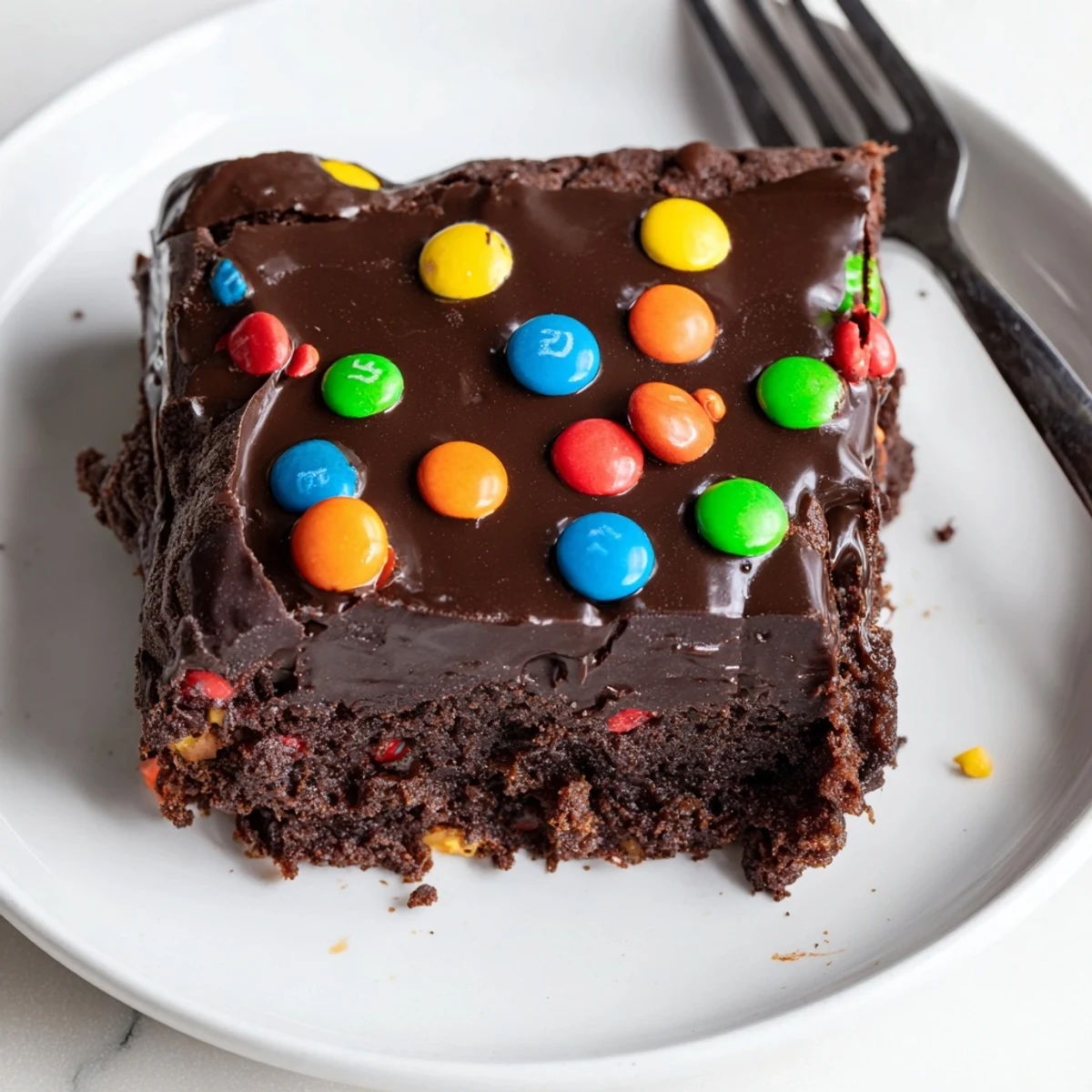 Sliced Gourmet Cosmic Brownies Bars chilled on parchment, fudgy center visible