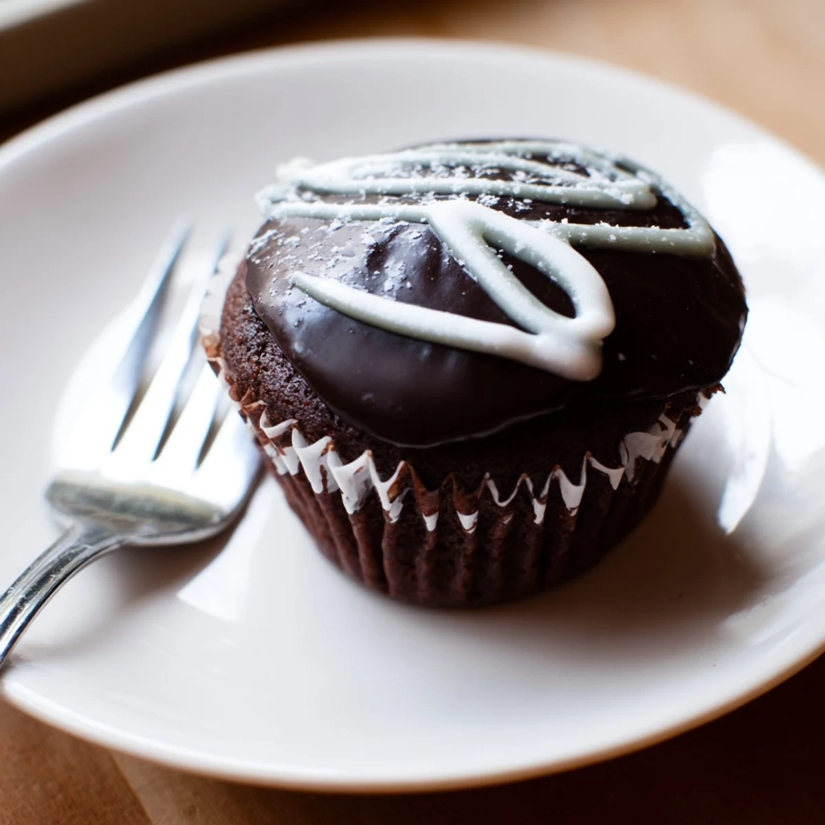Fluffy Homemade Hostess Cupcakes filled with creamy marshmallow center on a wire rack